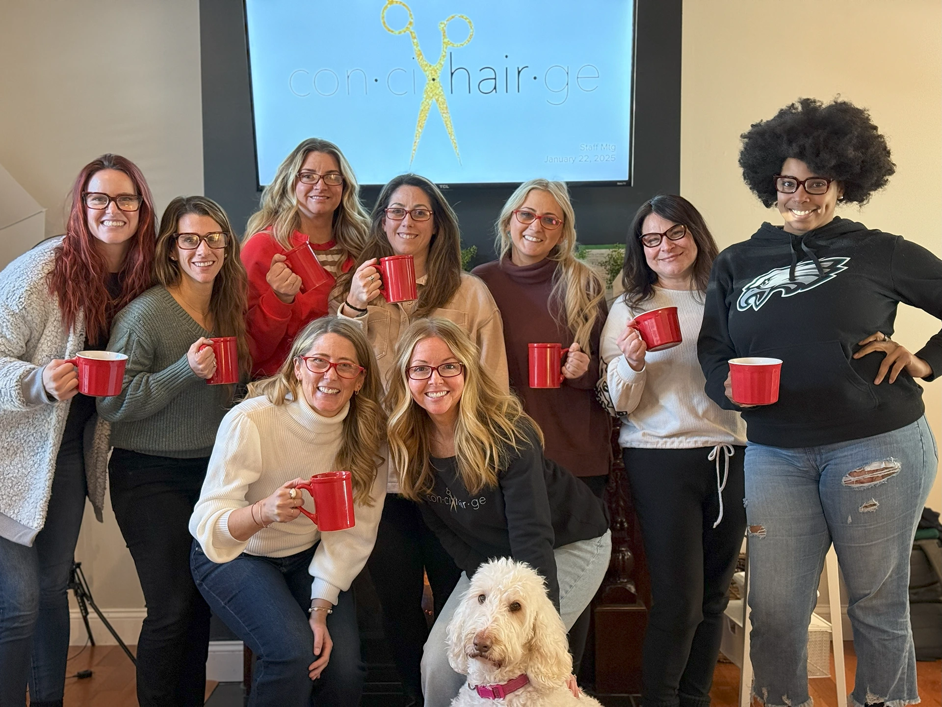 a group of women holding red cups